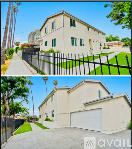 A two-story house with a garage and a driveway.