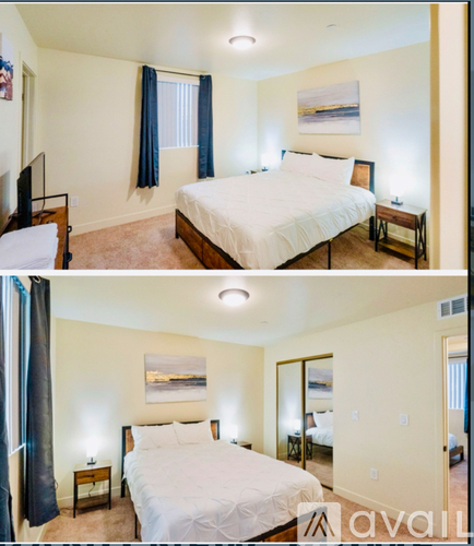A bedroom with a large bed and a television.