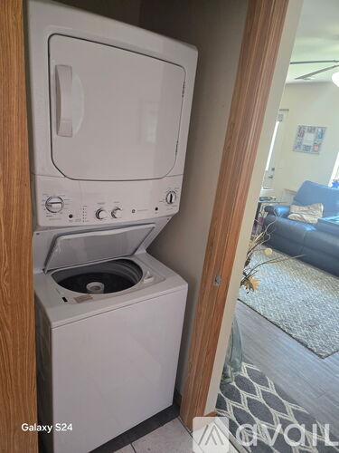 A white Galaxy S24 dishwasher is in a kitchen.
