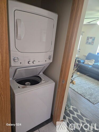 A white Galaxy S24 dishwasher is in a kitchen.