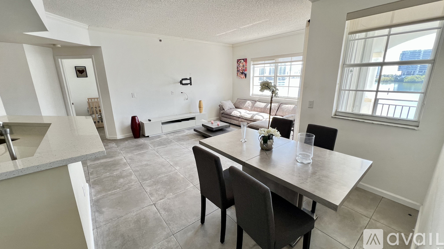 A dining area with a table and chairs is available for rent.