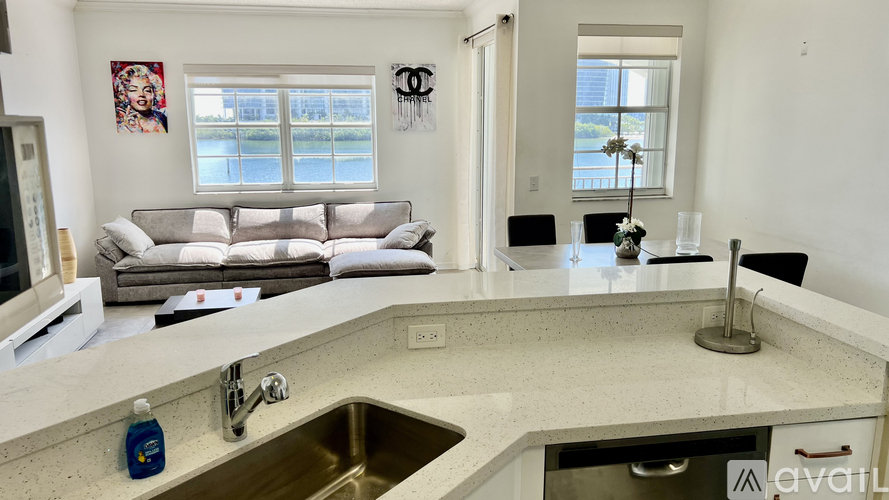 A kitchen with a sink and a window.