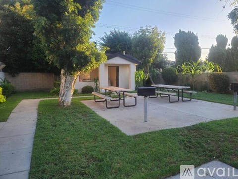 A small building with a bench in front of it is available for rent.