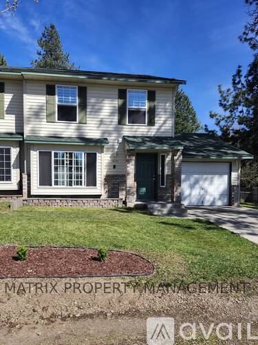A house with a green lawn and a sign that says Matrix Property Management.