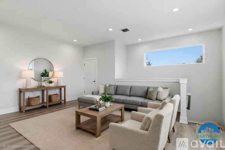 A living room with a sofa, chairs, and a coffee table.