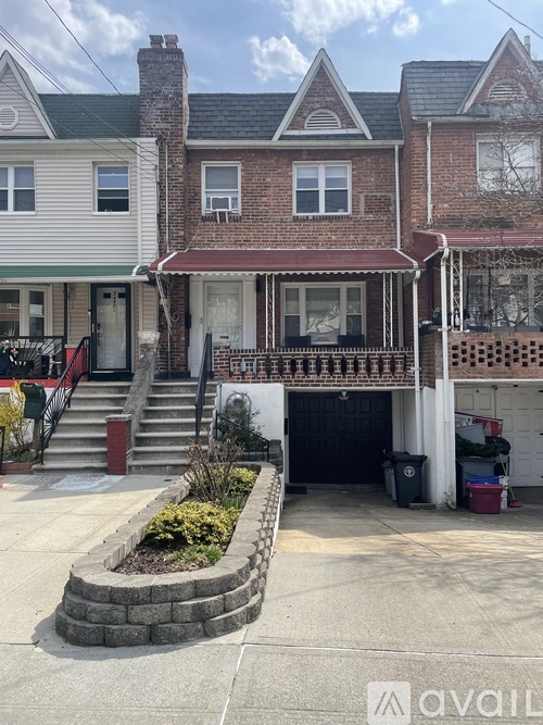 A house with a front yard and a garage.