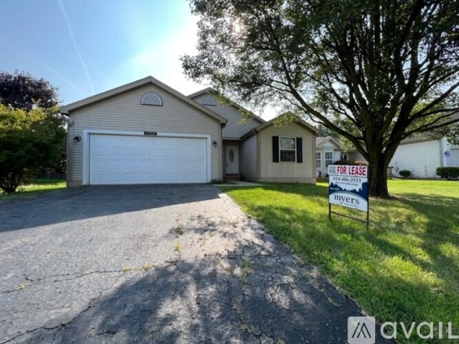 A house with a garage is for lease.