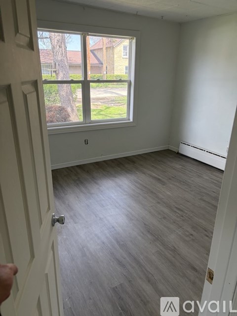 A room with a window and a door.