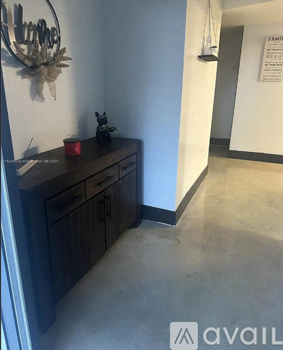 A hallway with a sign that says "FAMILY" on the wall.