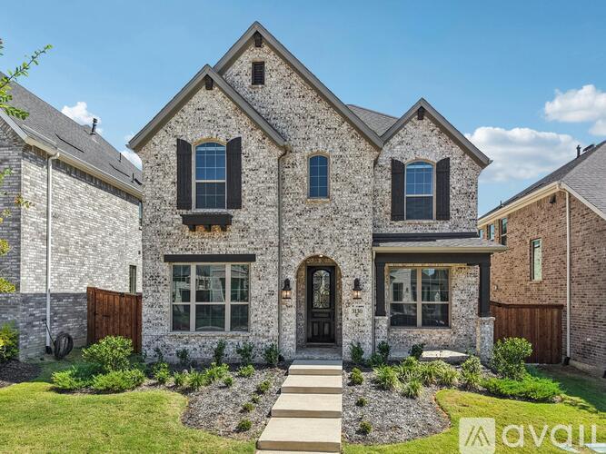 A house with a stone facade and a wooden door.