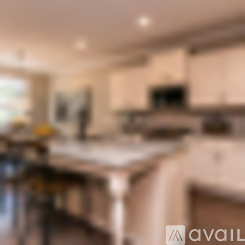 A kitchen with a counter and a stove.