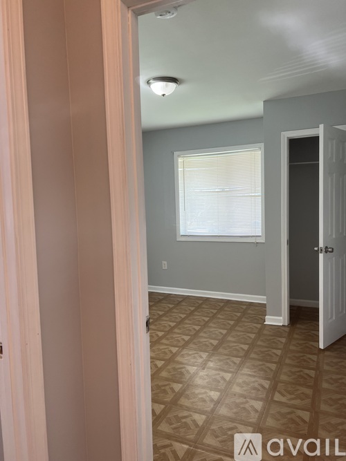 A room with a door and a window.