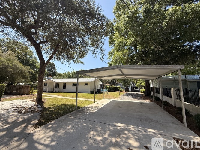 A sunny day at a residential area with houses and trees.