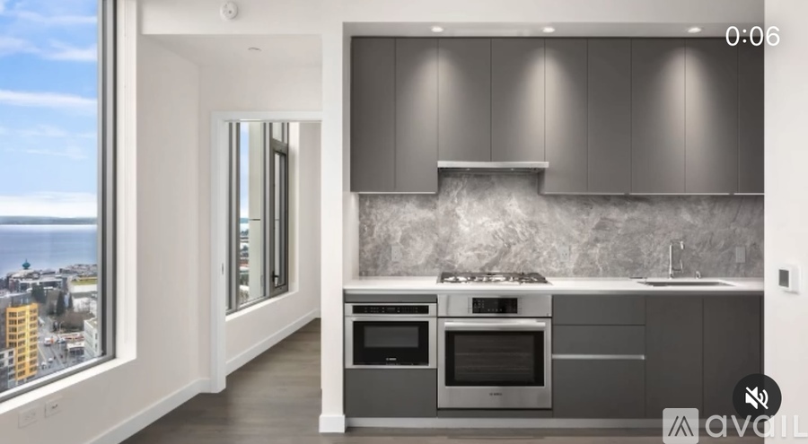 A modern kitchen with a view of the city.