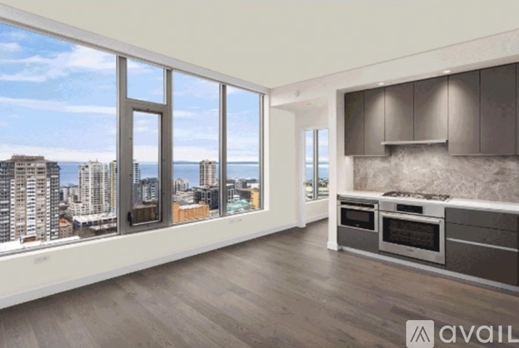 A modern kitchen with a view of the cityscape.
