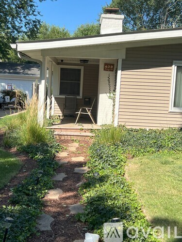 A house numbered 502 with a white door and a small porch.