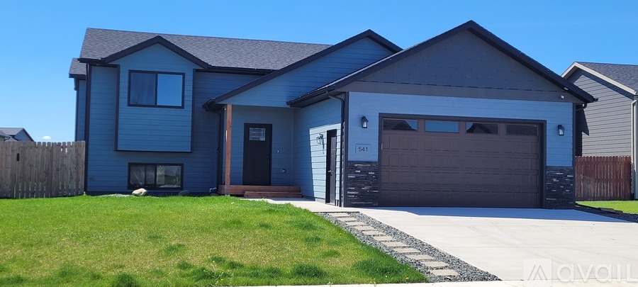 A two-story house with a garage on the right side.
