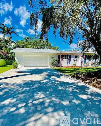 A house with a driveway in front of it.