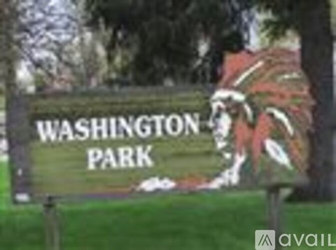 A sign for Washington Park with a Native American headdress on it.