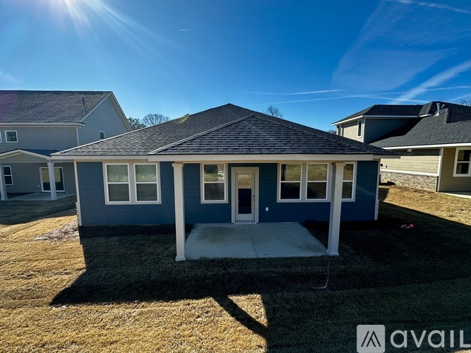 A house with a blue exterior is available for purchase.