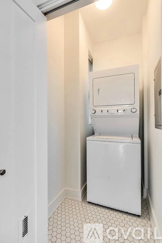 A white oven and microwave in a small kitchen.