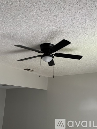 A fan is hanging from the ceiling.