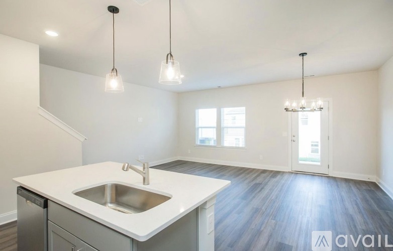A kitchen with a sink and a countertop is available for rent.
