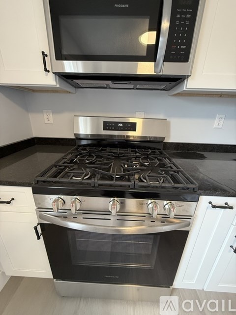 A modern kitchen with a stainless steel stove and oven.