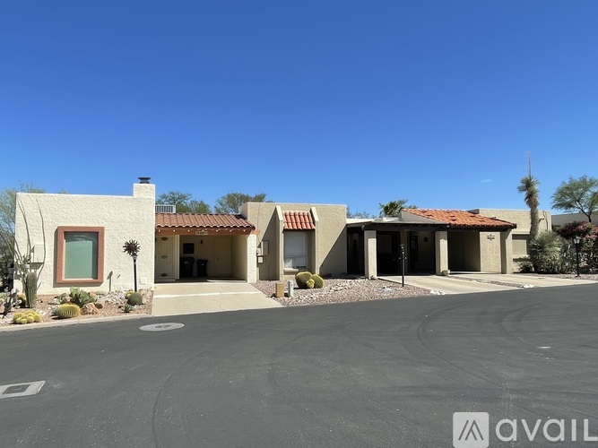 A house with a driveway in front of it.