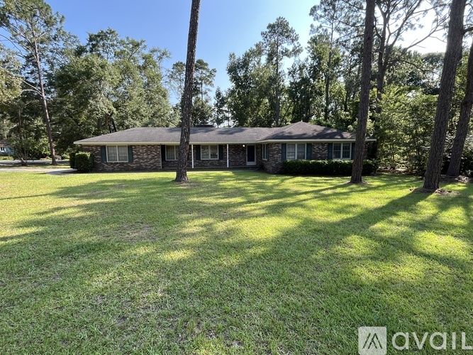A house with a lawn in front of it is for sale.
