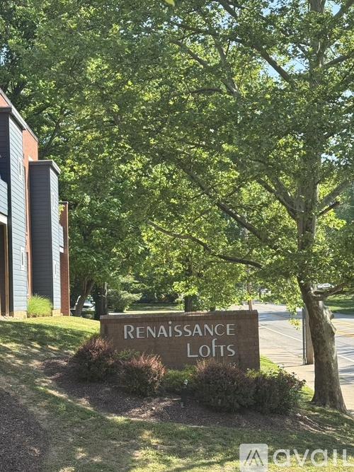 A sign that says Renaissance Lofts is in front of a building.
