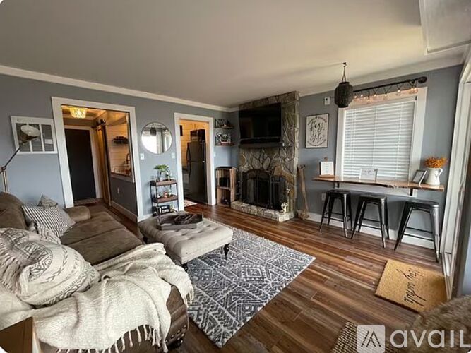 A living room with a fireplace and a couch.