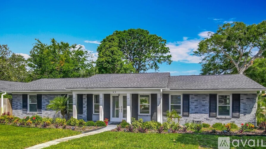 A house with a front yard and a sign that says "available".