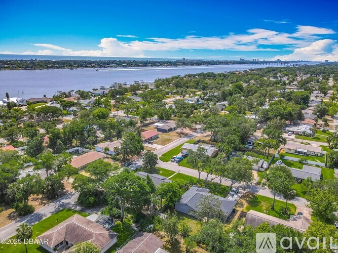 A bird's eye view of a residential area with houses and trees.