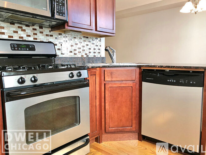 A kitchen with a black stove top oven, a black microwave, and a black dishwasher.