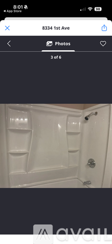 A white door with a handle and a lock.