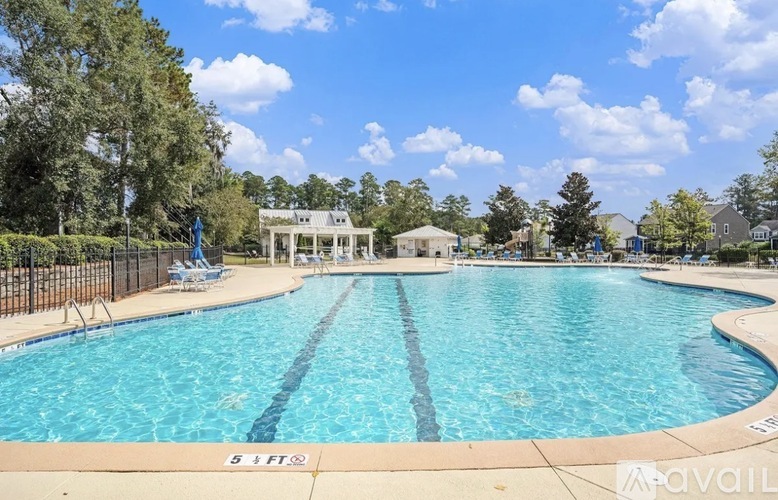 A large swimming pool with a depth marker reading 5 feet.