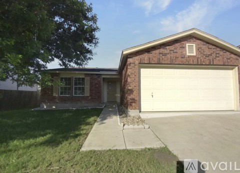 A house with a brick exterior and a white garage door.