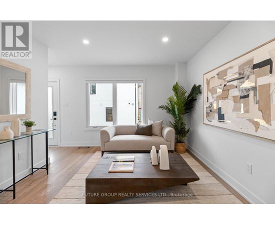 A modern living room with a glass coffee table and a large abstract painting on the wall.
