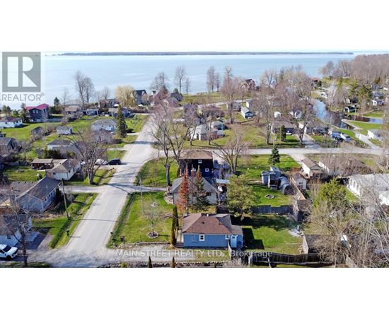 A Main Street Realty Ltd. logo is superimposed on an aerial view of a residential neighborhood.