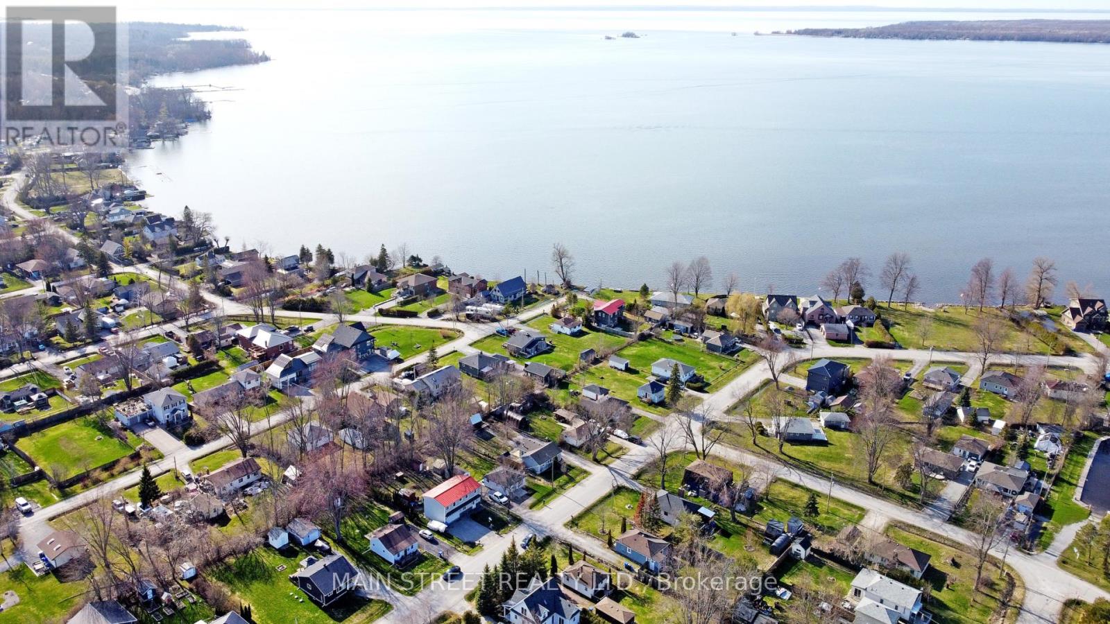 A bird's eye view of a residential neighborhood with houses and streets.