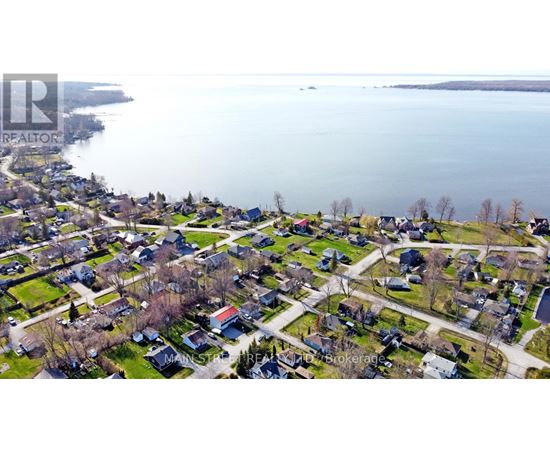 A bird's eye view of a residential neighborhood with houses and streets.