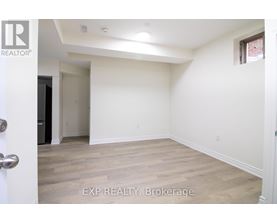A room with EXP REALTY, Brokerage written on the floor.