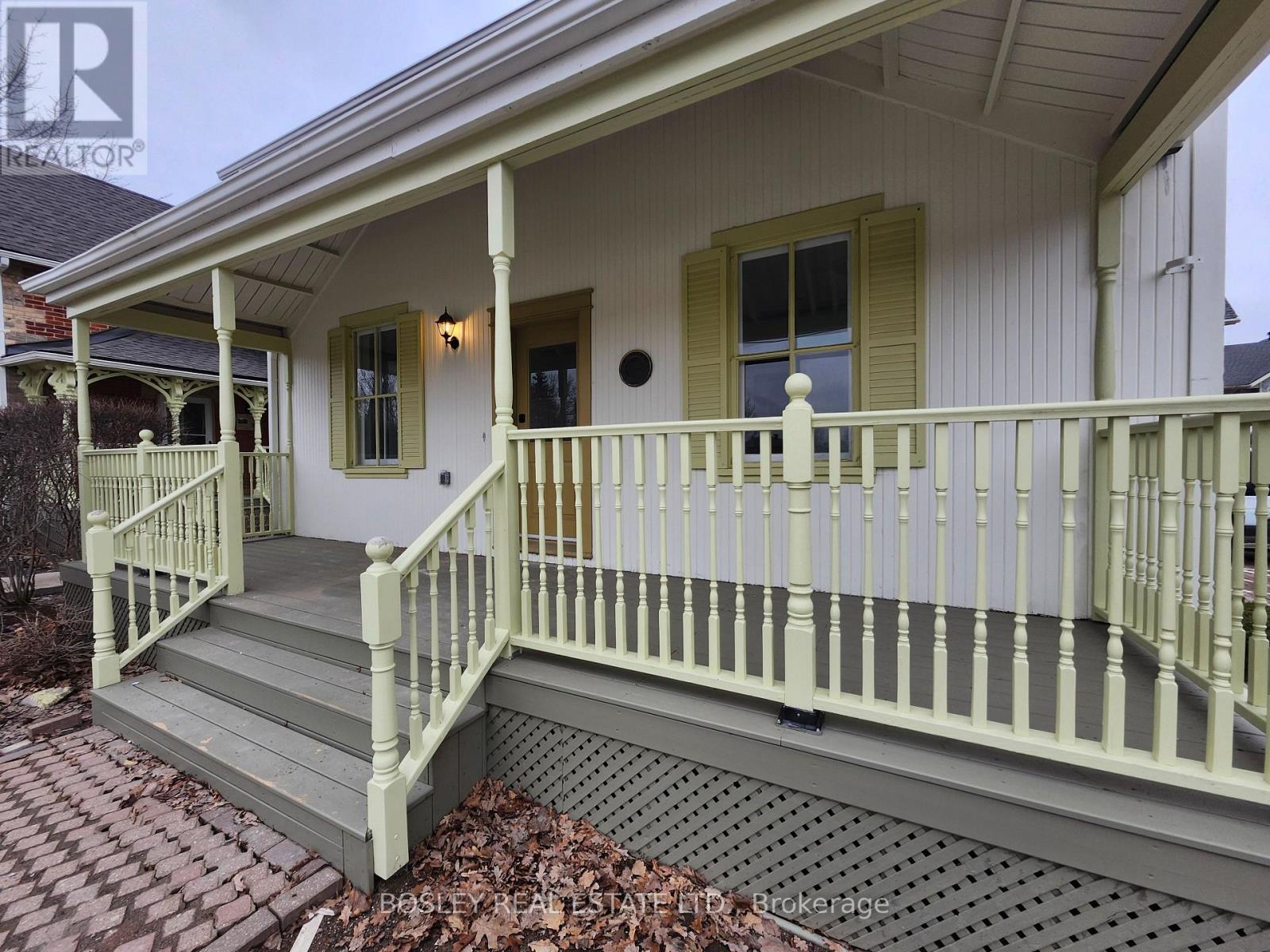 A house with a porch and a covered patio.