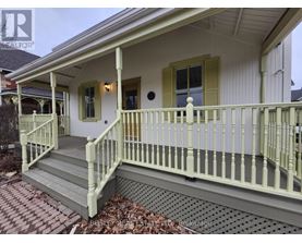 A house with a porch and a covered patio.