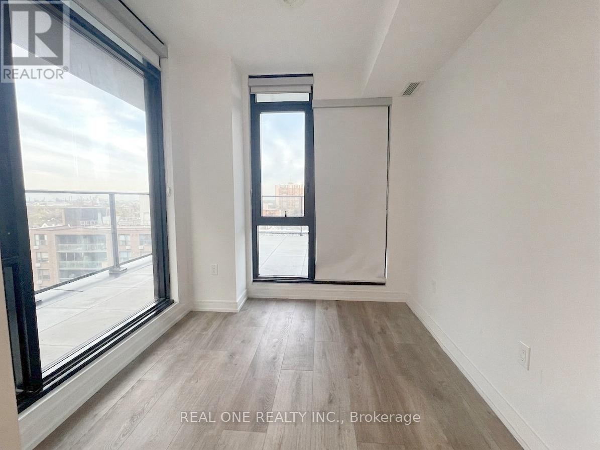 A room with a large window and a sliding door.