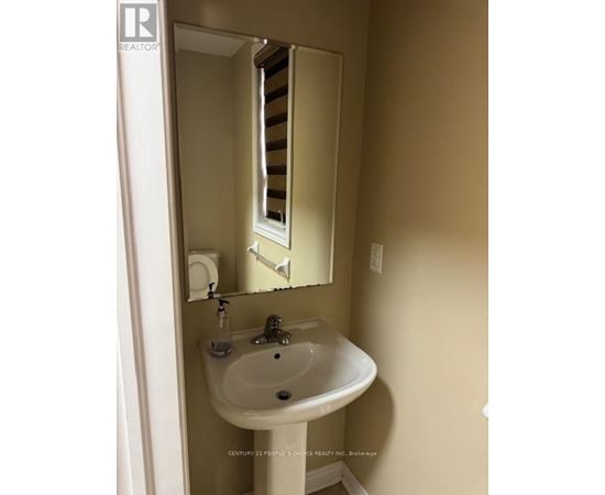 A bathroom with a sink and mirror.