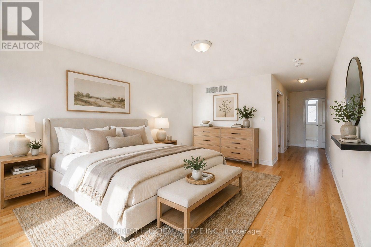 A bedroom with a large bed, nightstands, and a bench.
