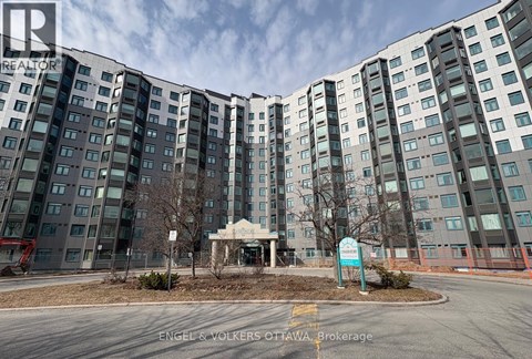 A large building with a sign in front that says Engel & Volkers Ottawa Brokerage.