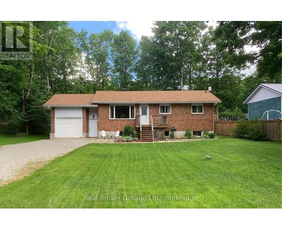 A house with a brown roof and a white garage door is for sale.